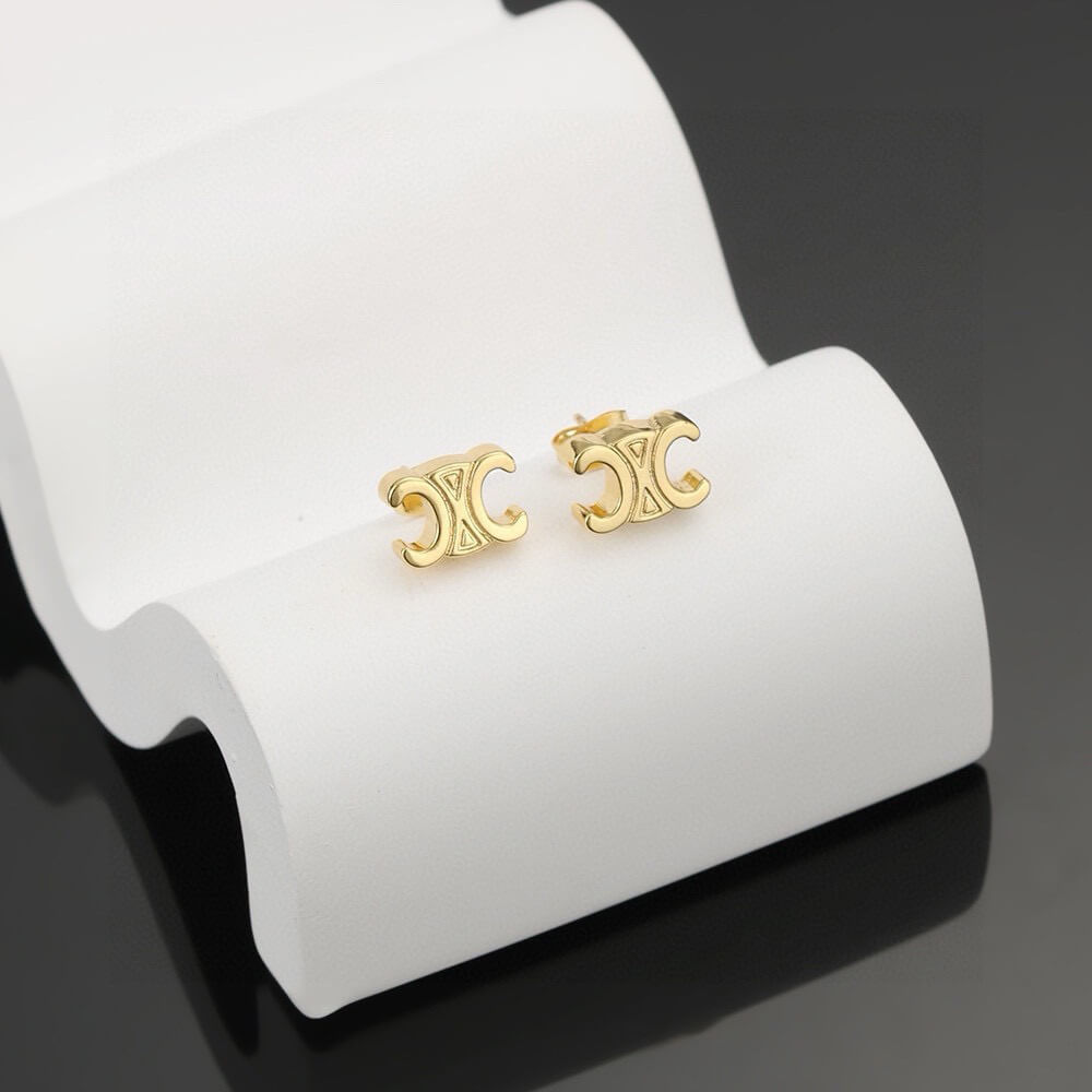 Ce**e triomphe studs in brass with gold finish